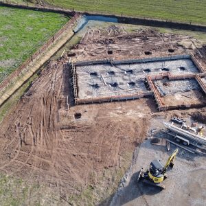yellow and black heavy equipment on brown field during daytime